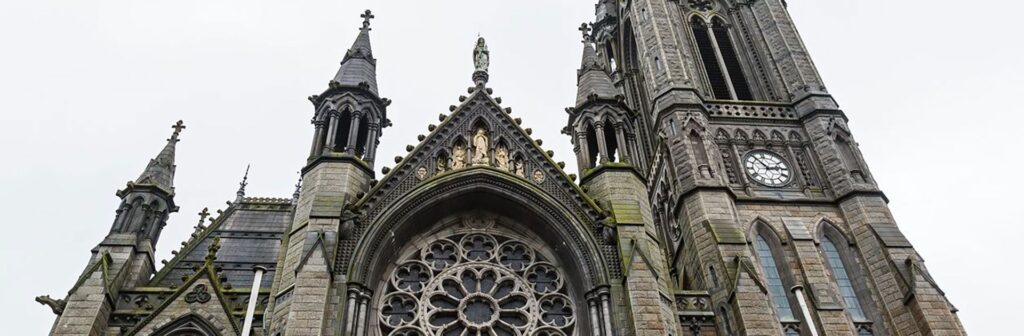 Gothic cathedral facade with ornate rose window.